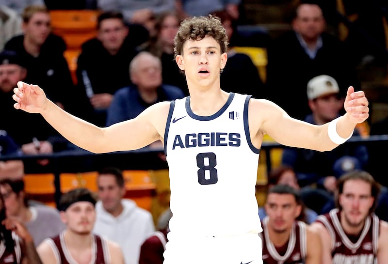 Utah State graduate guard Drake Allen gathers his teammates together during the Aggies' 95-83 win over Montana on Nov. 18 at the Spectrum in Logan.