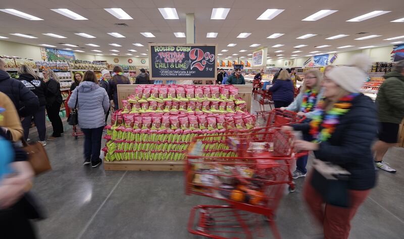 Customers shop the many items as Trader Joe’s in Draper opens for business on March 3, 2023.