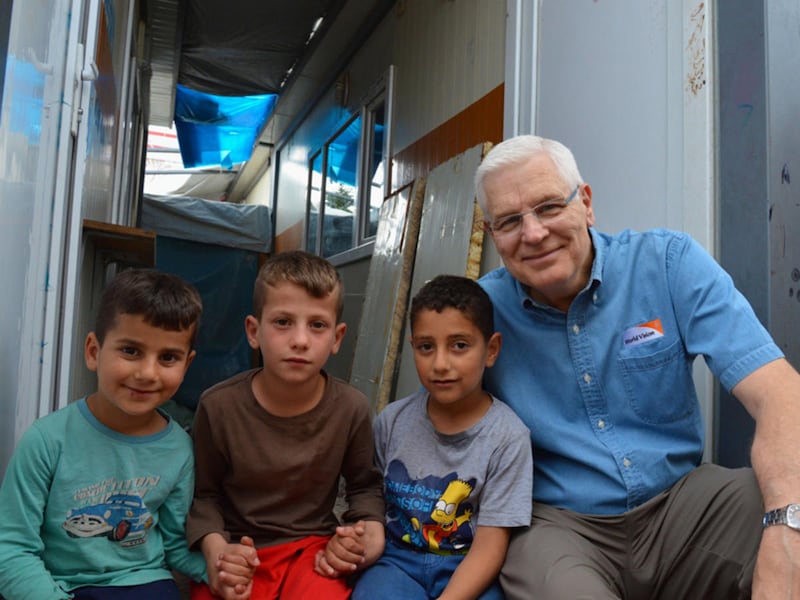 Richard Stearns, president of World Vision, U.S., sits with children in the Kurdish Region of Iraq, who have been displaced by the conflict in their country.