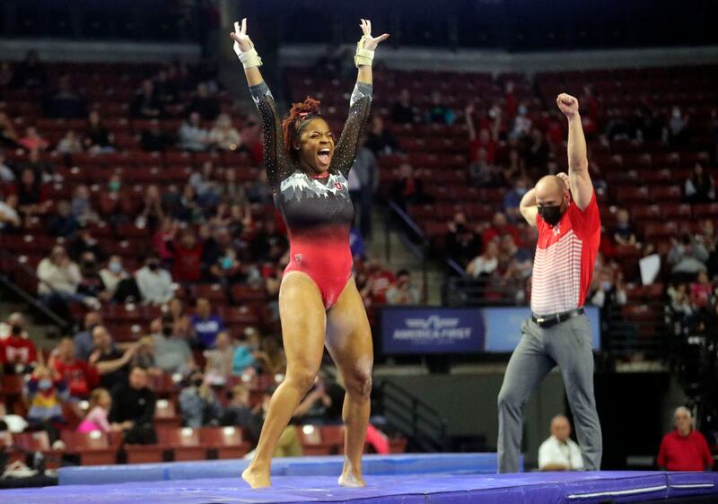 The University of Utah’s Cammy Hall reacts after competing on the vault against Brigham Young University, Utah State University and Southern Utah University in the Rio Tinto Best of Utah NCAA gymnastics meet.