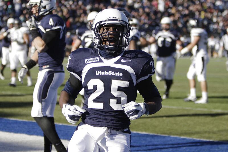 Utah State Aggies running back Kerwynn Williams (25) celebrates his touchdown against Nevada in Logan Saturday, Nov. 26, 2011.