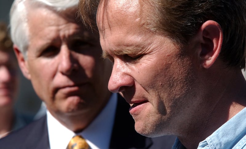 Ed Smart talks about the abduction of his 14-year-old daughter Elizabeth as Salt Lake City Police Chief C.F. “Rick” Dinse listens during a press conference.