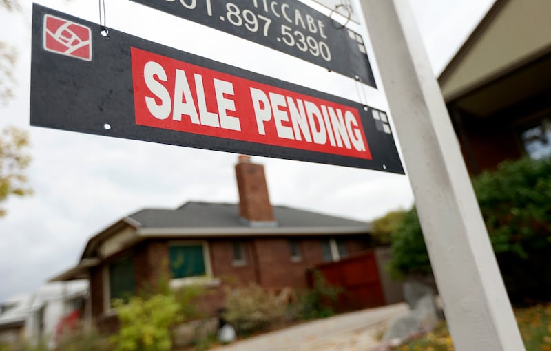 A “For Sale” sign and “Sale Pending” sign are pictured in Salt Lake City on Oct. 18, 2021.