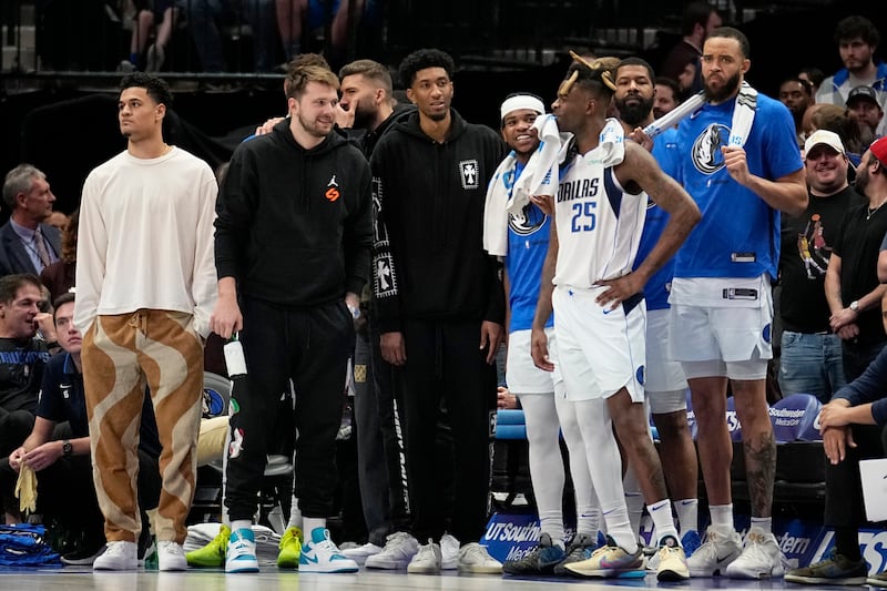 The Dallas Mavericks bench watches play against the Chicago Bulls on Friday, April 7, 2023, in Dallas.