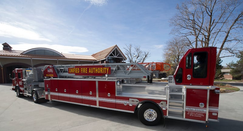 FILE - Unified Fire Authority fire fighters drive a new Rosenbauer Tractor Drawn Aerial Fire (TDA) Truck at Unified Fire Station 106 in Millcreek on Thursday, Nov. 9, 2017. The group Alliance for a Better Utah on Tuesday called on Salt Lake County Council