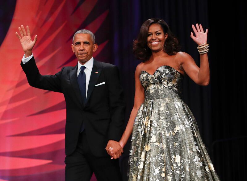 FILE - In this Oct. 8, 2016 file photo, President Barack Obama and first lady Michelle Obama wait to greet Italian Prime Minister Matteo Renzi and his wife Agnese Landini for a State Dinner at the White House in Washington. Netflix says that it has reache