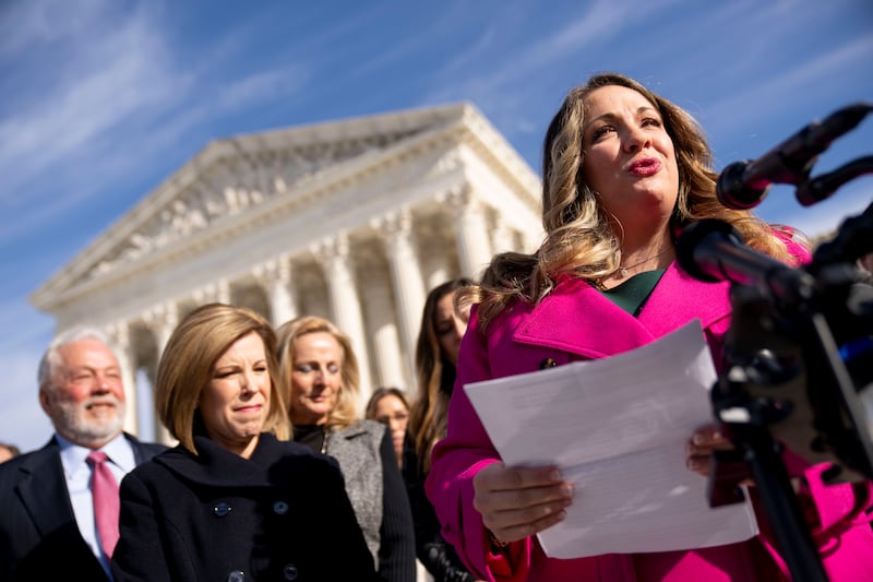 Lorie Smith and her lawyer, Kristen Waggoner, speak outside the Supreme Court, Monday, Dec. 5, 2022.