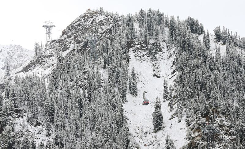 The Snowbird tram climbs past  the new snow  in Little Cottonwood Canyon on Friday, Sept. 23, 2016.