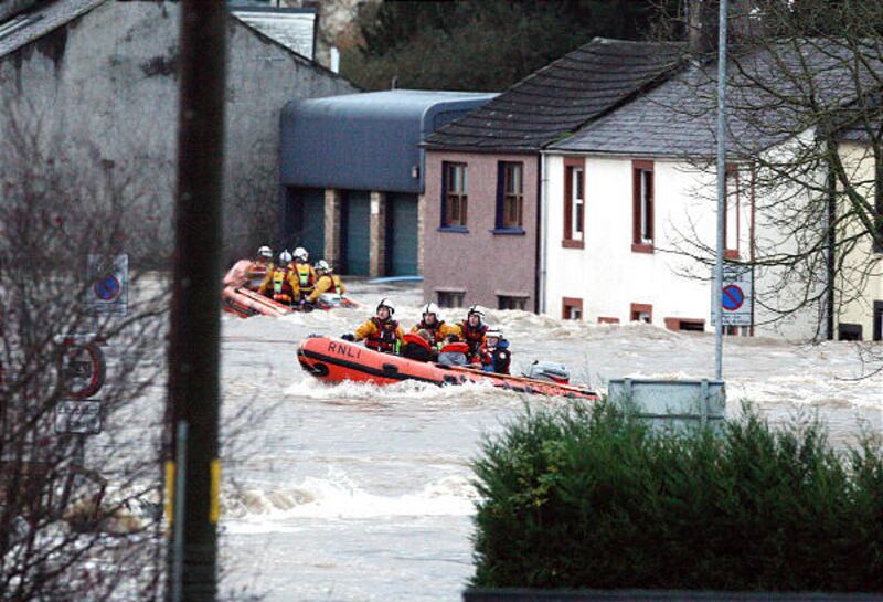 Rescue services navigate the flood waters, in the streets of Cockermouth village, England, as they work to rescue stranded residents from their homes, after heavy rains caused local flooding in the picturesque village, Friday, Nov. 20, 2009. The Royal A
