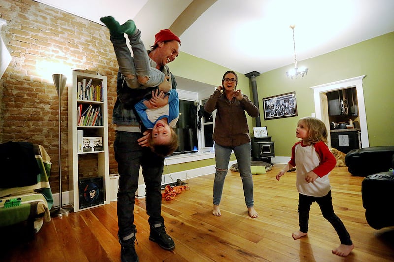 Aliska and Nate Julian play with their sons, Morrissey and Ander, at their home in Salt Lake City on Tuesday, Oct. 10, 2017. The couple has decided to have only two children.