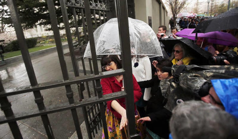 Kate Kelly, founder of Ordain Women, walks through the gate onto Temple Square to the LDS Tabernacle in Salt Lake City, Saturday, April 5, 2014 to ask for entrance into the priesthood session of general conference.