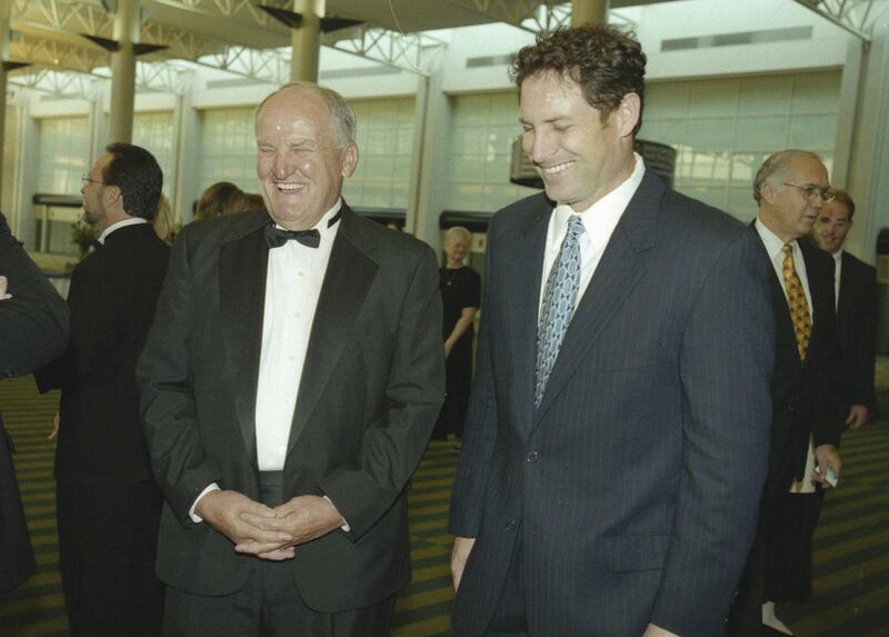 Former BYU head football coach Lavell Edwards laughs with Steve Young during a tribute Apr 11, 2001.