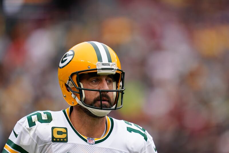 Green Bay Packers quarterback Aaron Rodgers walks off the field after the first half of a game against the Washington Commanders, Sunday, Oct. 23, 2022.