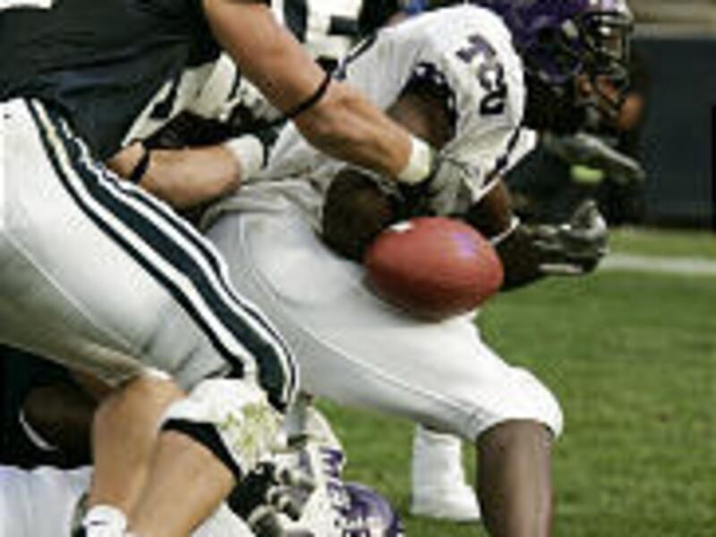 TCU's Cory Rodgers loses the ball near the goal line in overtime. Officials ruled Rodgers scored prior to dropping the ball, and the subsequent extra point won the game.
