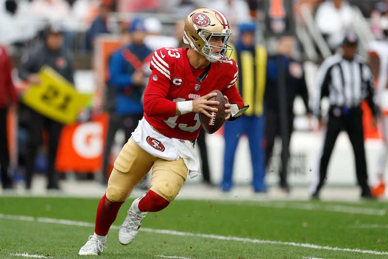 San Francisco 49ers quarterback Brock Purdy rolls out against the Cleveland Browns during a game on Oct. 15, 2023.