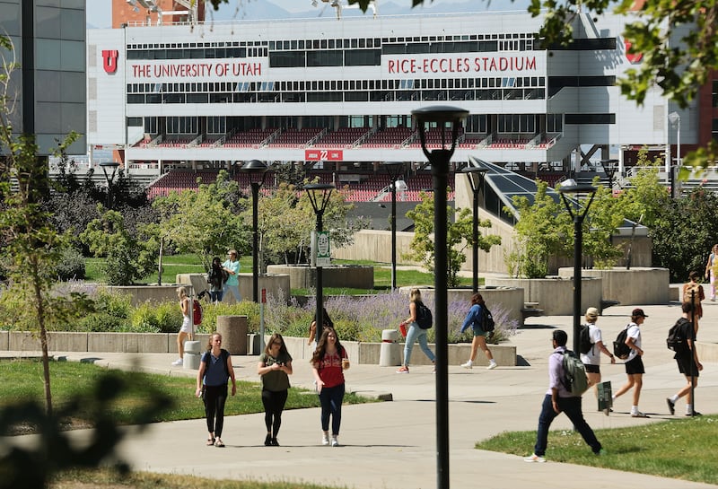 Students walk on the University of Utah campus in Salt Lake City.