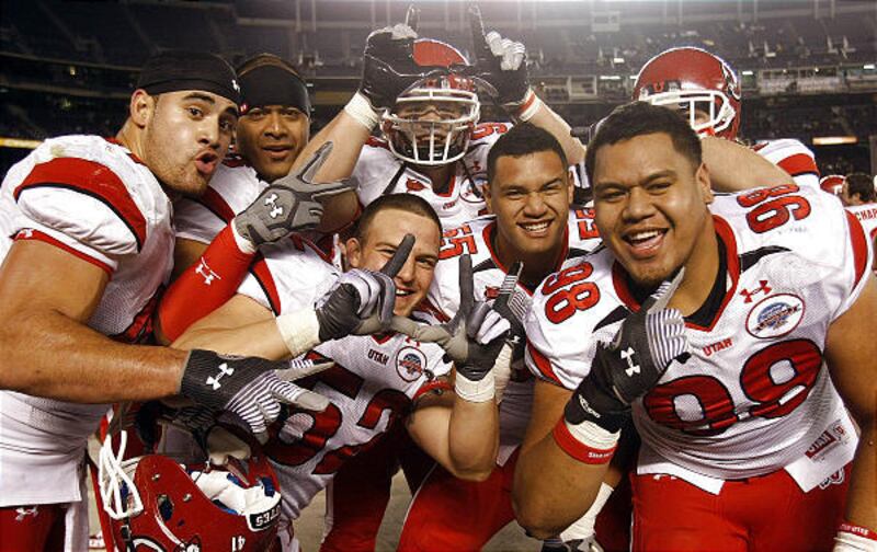 Utah players celebrate after extending the school's winning streak in bowl games to nine with a win over California.