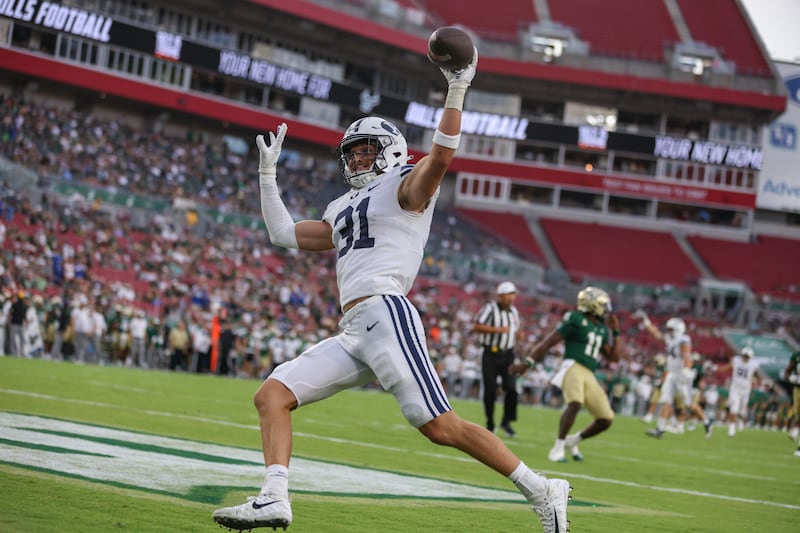 BYU linebacker Max Tooley scores a pick-six in BYU’s season opener against USF in Tampa, Florida.