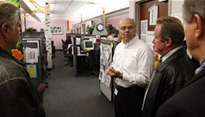 Dave Rose, center, discusses the Ann Taylor division at Convergys during a tour with Murray Mayor Daniel Snarr, left, Taylorsville Mayor Russ Wall, center right, and Dale Carpenter, Salt Lake County economic development director.