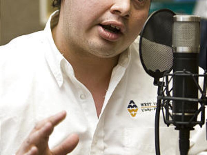 Enrique Sosa, Hispanic Neighborhood Services specialist in West Valley, speaks on a radio call-in show.