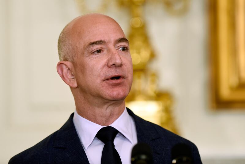 FILE - In this May 5, 2016 file photo, Jeff Bezos, the founder and CEO of Amazon.com, speaks in the State Dining Room of the White House in Washington. President Donald Trump is criticizing the U.S. Postal Service, saying the agency is “losing many billio