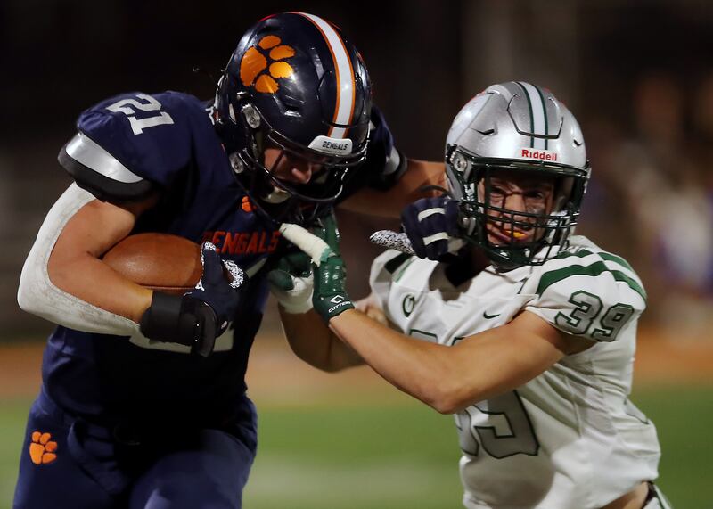 Brighton’s Lander Barton tries to fend off Olympus’ James Smith.