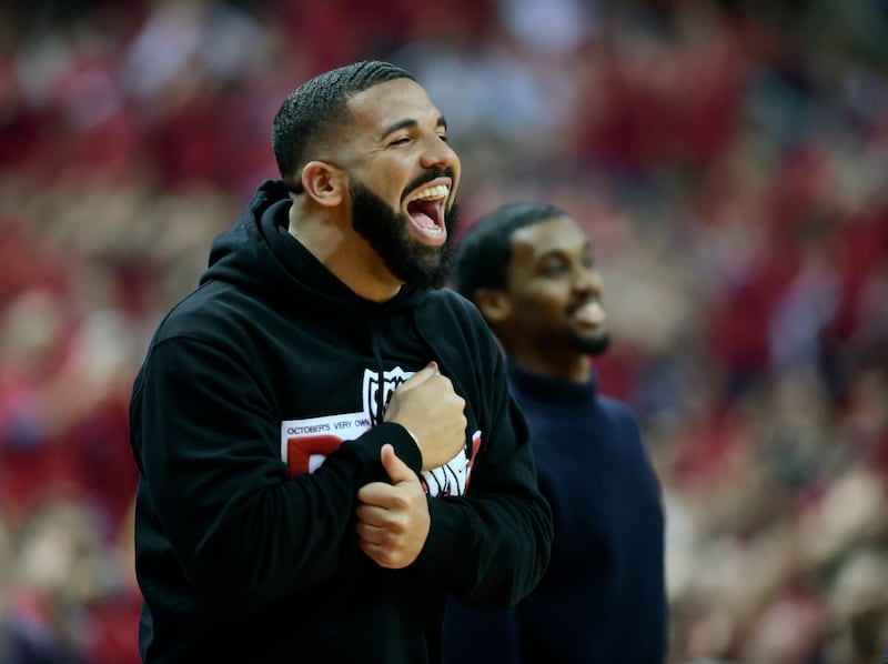 Drake smiles as he watches the Toronto Raptors take on the Milwaukee Bucks during the first half of Game 4 of the NBA basketball playoffs Eastern Conference finals, Tuesday, May 21, 2019 in Toronto. (Frank Gunn/The Canadian Press via AP)