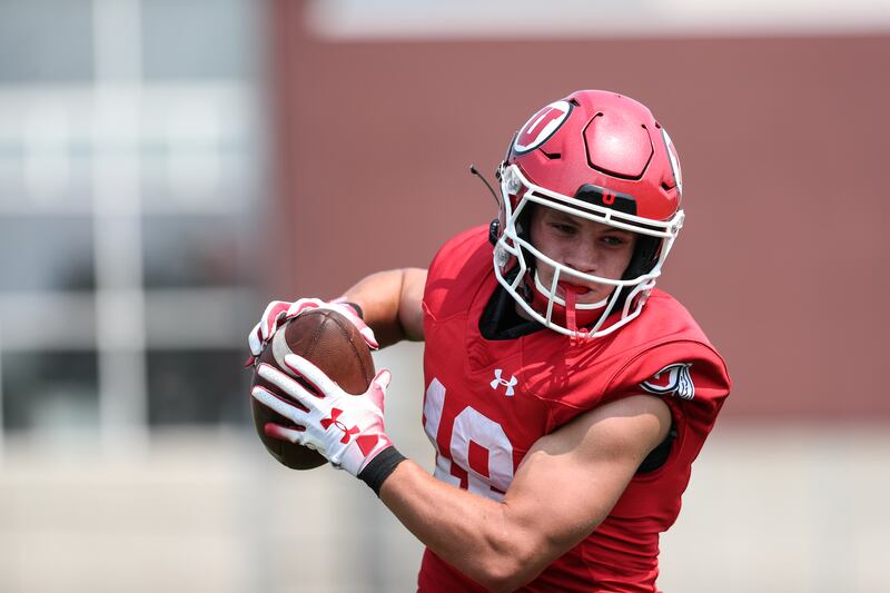 Utah receiver Britain Covey makes a move after catching a ball during fall camp at the University of Utah in Salt Lake City.