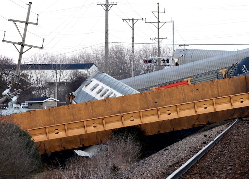 Multiple cars of a Norfolk Southern train lie toppled on one another after derailing at a train crossing with Ohio 41 in Clark County, Ohio.