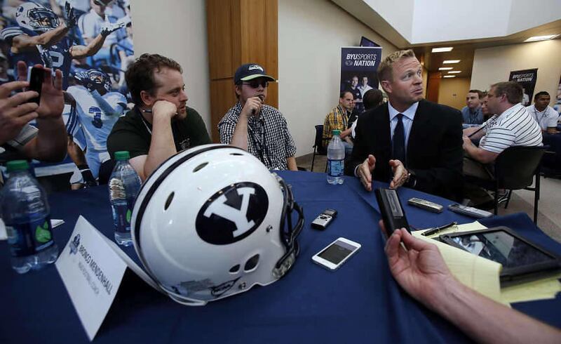 BYU Head Coach Bronco Mendenhall is interviewed during BYU Football Media Day in Provo, Monday, June 23, 2014.
