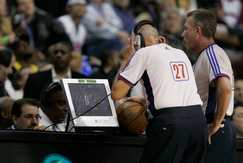 Referees Dick Bavetta, left, and Phil Robinson review a play in the Los Angeles Lakers-Detroit Pistons game in Auburn Hills, Thursday March 26, 2009.
