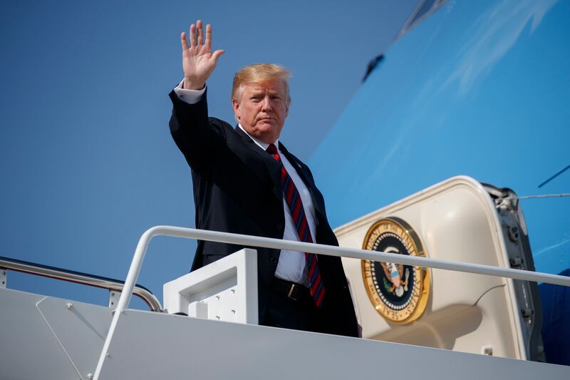 President Donald Trump waves as he boards Air Force One for a trip to New York to attend a fundraiser, Thursday, May 16, 2019, at Andrews Air Force Base, Maryland.