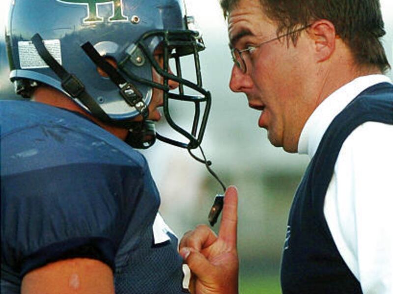 Mike Smith, shown here in his final year as Copper Hills head coach in 2004, has stepped down as Olympus High School's football coach.