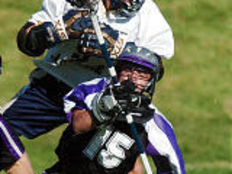 Skyline's Walker Hewlett (top), who scored four goals, takes out Riverton goalkeeper Corey Heward in the state lacrosse title game.