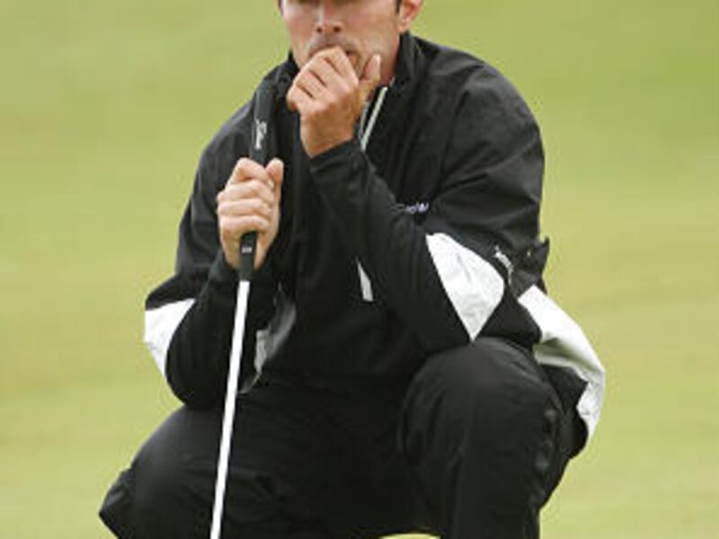 Mike Weir of Canada lines up a putt during round two of the 138th Open Championship on the Ailsa Course, Turnberry Golf Club.