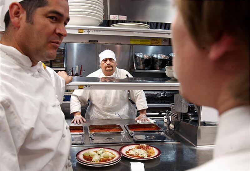 Cucina partner Jose Acevedo, left, chef U.B. Cabrera and waiter Patrick Morrison work the lunch shift at Bucca di Beppo in Salt Lake City Thursday. Salt Lake County has a new Web site that allows residents to find details about food service inspections as