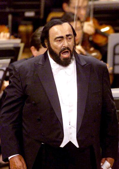 Tenor Luciano Pavarotti sings during a concert marking the 40th anniversary of his debut, in his native town of Modena, central Italy, April 29, 2001. Pavarotti made his debut as Rodolfo in Puccini's "La Boheme" at Reggio Emilia, Italy, in 1961. Ron Howar