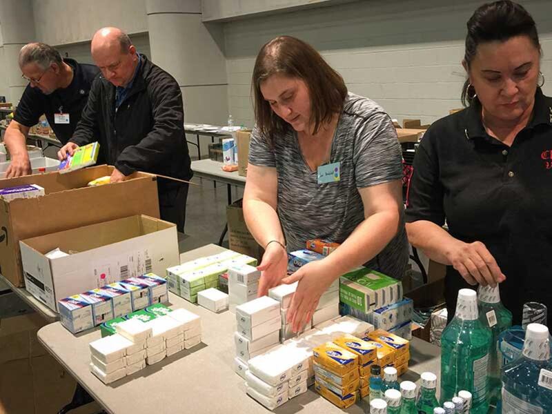 Brian Scroggins (second from left) and volunteers at the Las Vegas Convention Center, where the city has set up a crisis center for victims of the shooting and their families.
