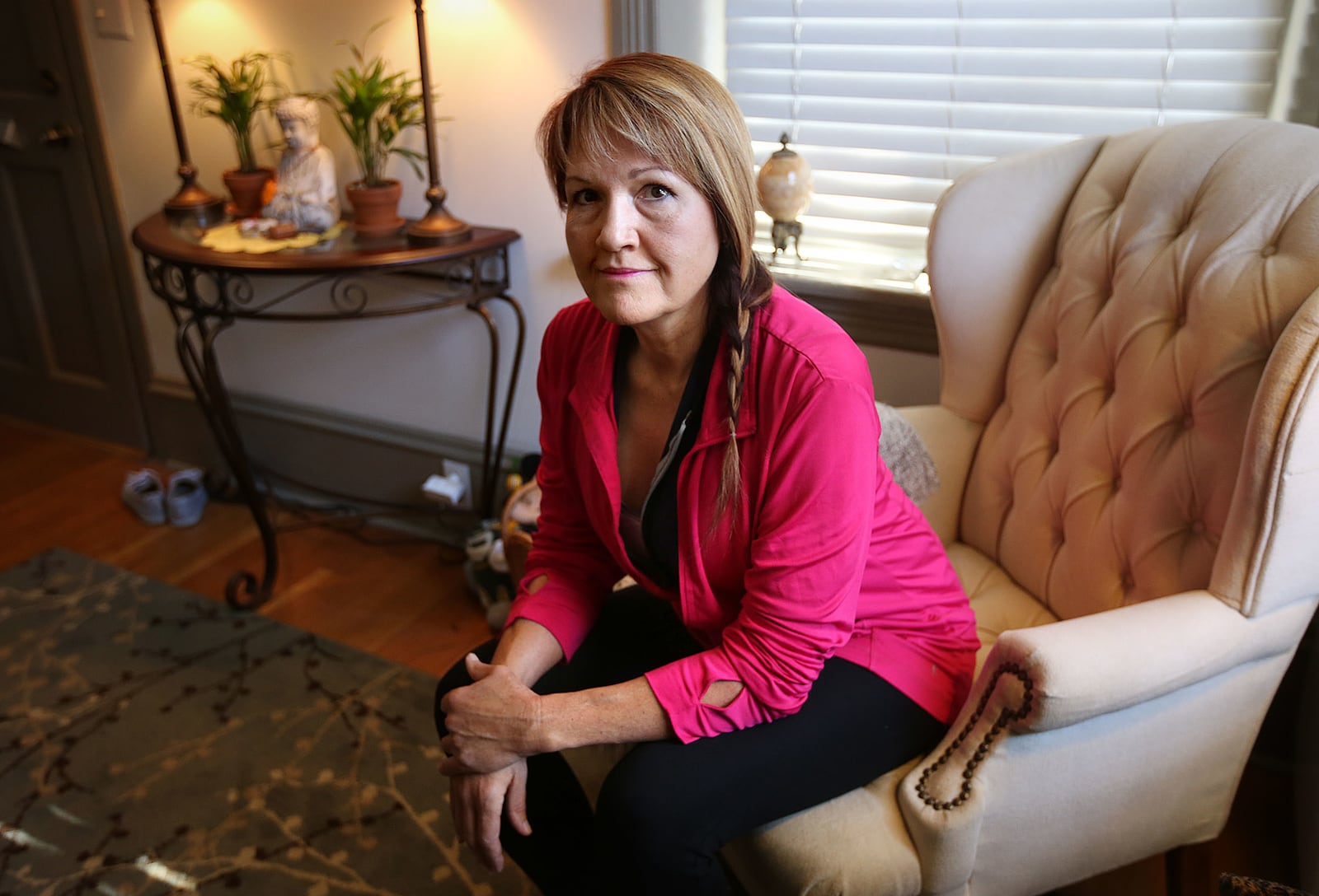 Tiffany Anderson, wellness coach, massage therapist and health educator, poses for a portrait at her home in Salt Lake City on Tuesday, March 27, 2018.