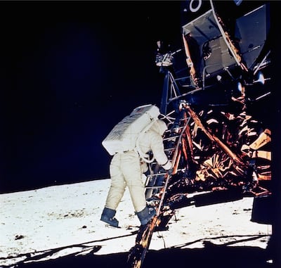 Astronaut Edwin E. Aldrin, Jr., lunar module pilot, descends steps of Lunar Module ladder as he prepares to walk on the moon, July 20, 1969. This picture was taken by astronaut Neil A. Armstrong, Commander, with a 70mm surface camera.
