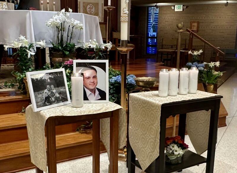 A memorial for Joshua Barrick is on display at Holy Trinity Catholic Church in Louisville, Ky.