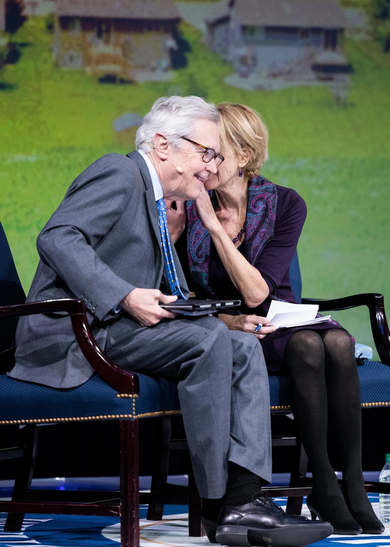 Journalists James and Deborah Fallows consult together during their BYU forum address at the Marriott Center in Provo, Utah.