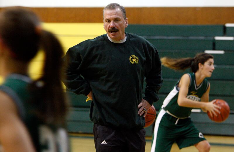 Joe Cravens coaches the girls high school basketball team at Saint Joseph Catholic High School in Ogden, Utah, Wednesday, Nov. 10, 2010. At right is Katie Panushka. (Ravell Call, Deseret News)