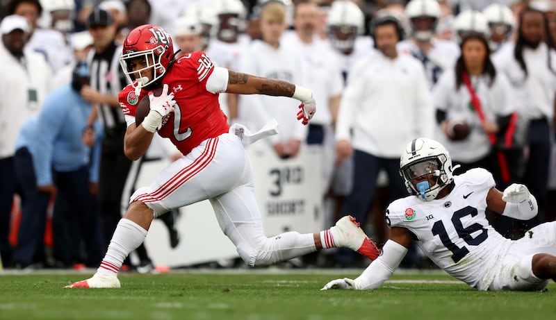 Utah Utes RB Micah Bernard (2) fights to regain his balance as Utah and Penn State play in the Rose Bowl in Pasadena, California, on Monday, Jan. 2, 2023.