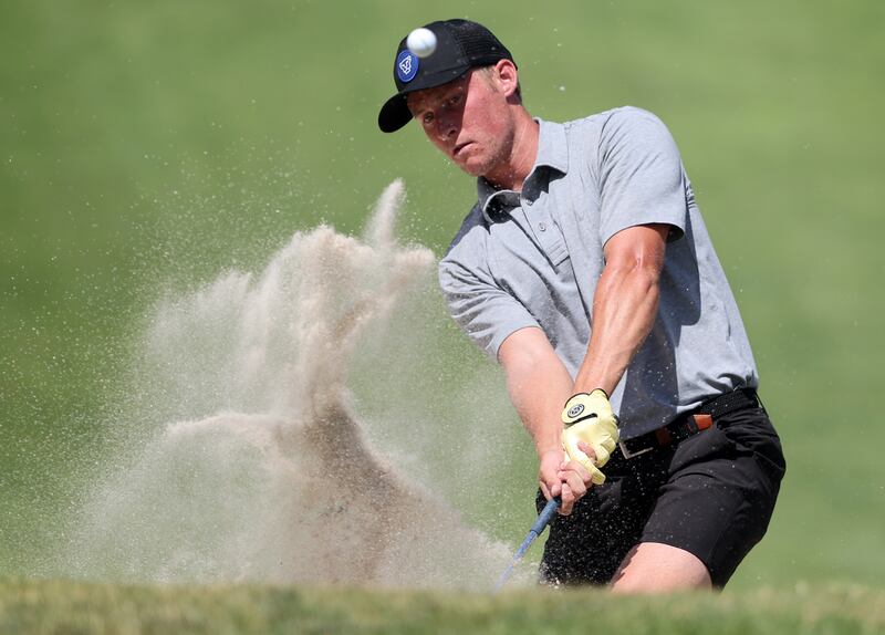 Zac Jones hits out of bunker as he and Simon Kwon battle it out in match play in the 124th Utah State Amateur Championship.