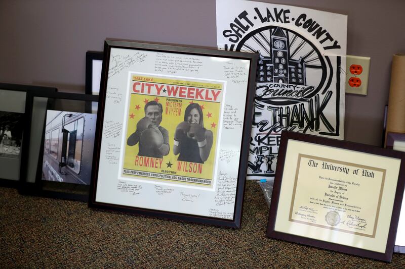 Photographs and memorabilia sit on the floor of newly elected Salt Lake County Mayor Jenny Wilson's undecorated office in the Salt Lake County Government Center on Thursday, March 28, 2019.