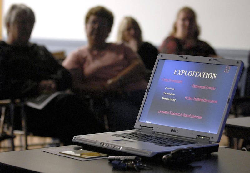 ** FILE ** In this May 22, 2008 file photo, parents listen to a seminar conducted by Connecticut State Police Sgt. Jim Smith of the state police cybercrimes unit in Windsor Locks, Conn. Teenagers' increasingly common habit of distributing nude self-portra
