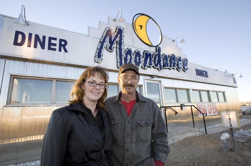 FILE - This Jan. 20, 2009 file photo shows Cheryl and Vince Pierce posing outside their Moondance Diner in La Barge, Wyo. Cheryl Pierce is calling it quits after three years of trying to make a go of the Moondance Diner. This time a victim of a slump in t