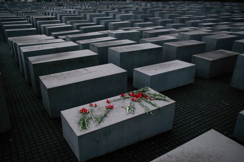 Flowers lie on a concrete slab of the Holocaust Memorial to mark the International Holocaust Remembrance Day in Berlin in 2015.