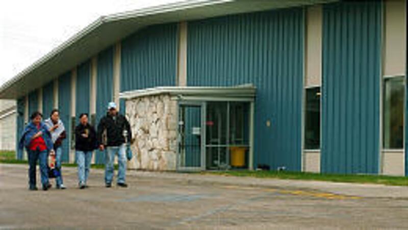 Workers leave Bear River Kitchens on Monday after authorities accused 52 of being illegal immigrants.